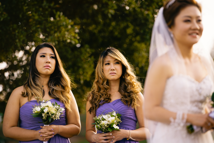 A picture of bridesmaids holding their tears at a Wedding