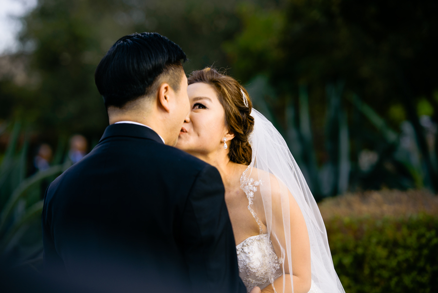 A bride gave a puzzled look as she realized that it wasn't the time to kiss her groom yet